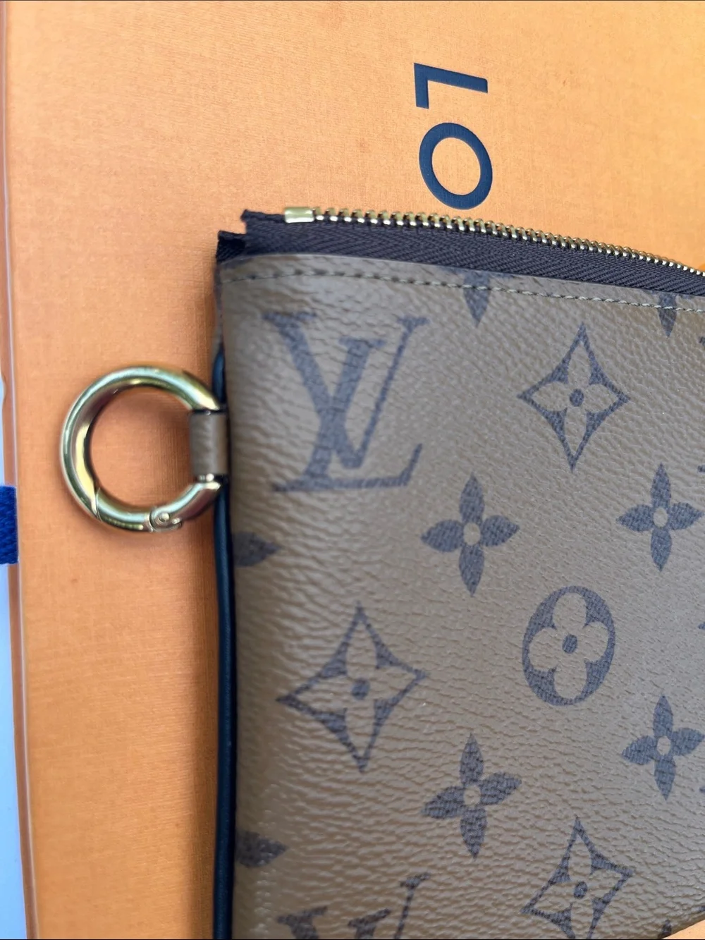 Louis Vuitton LV monogram reverse square pouch from Trio Pouch